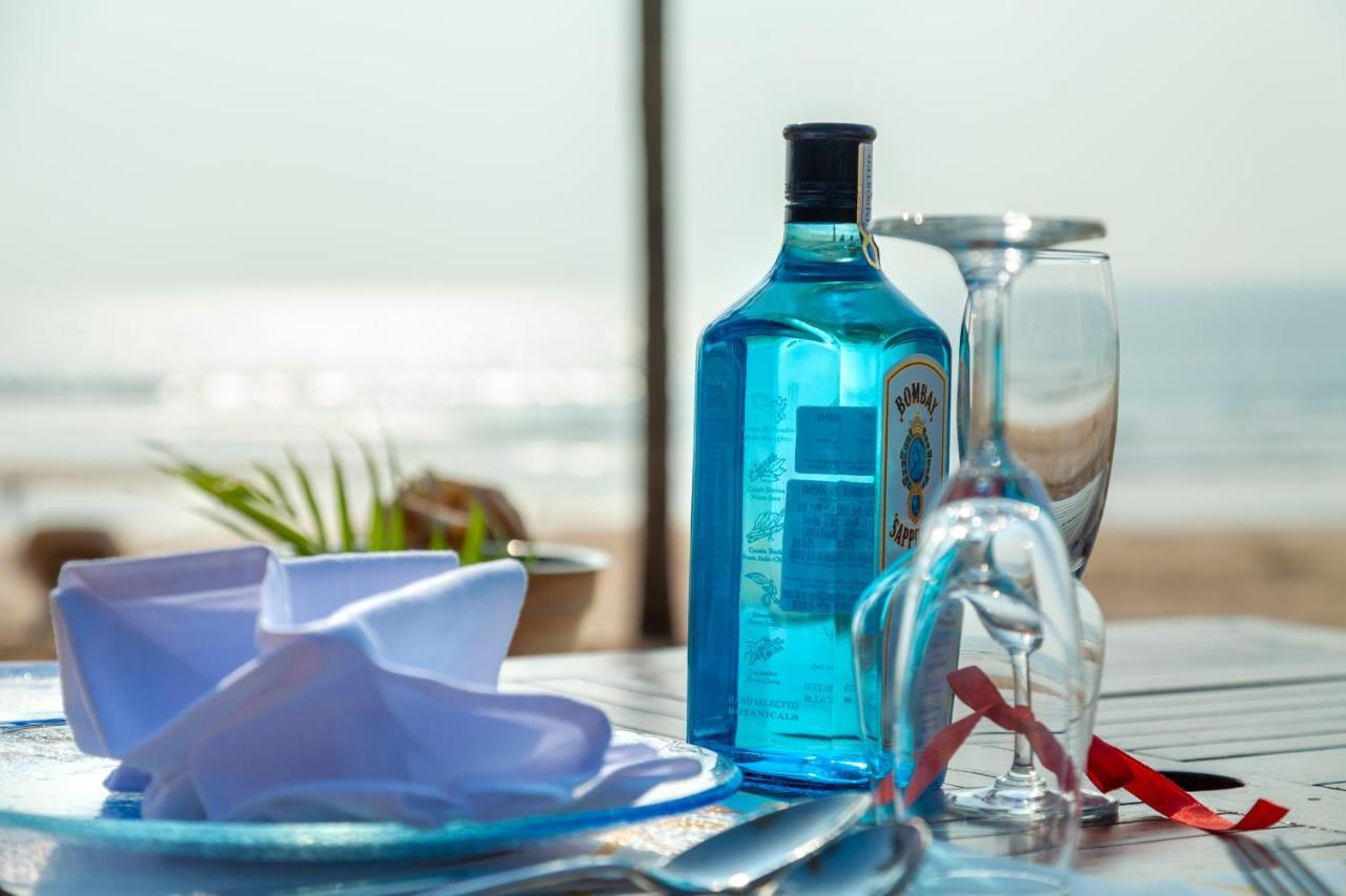 Caravela Beach Resort Varca Extérieur photo A bottle of Blue Curaçao