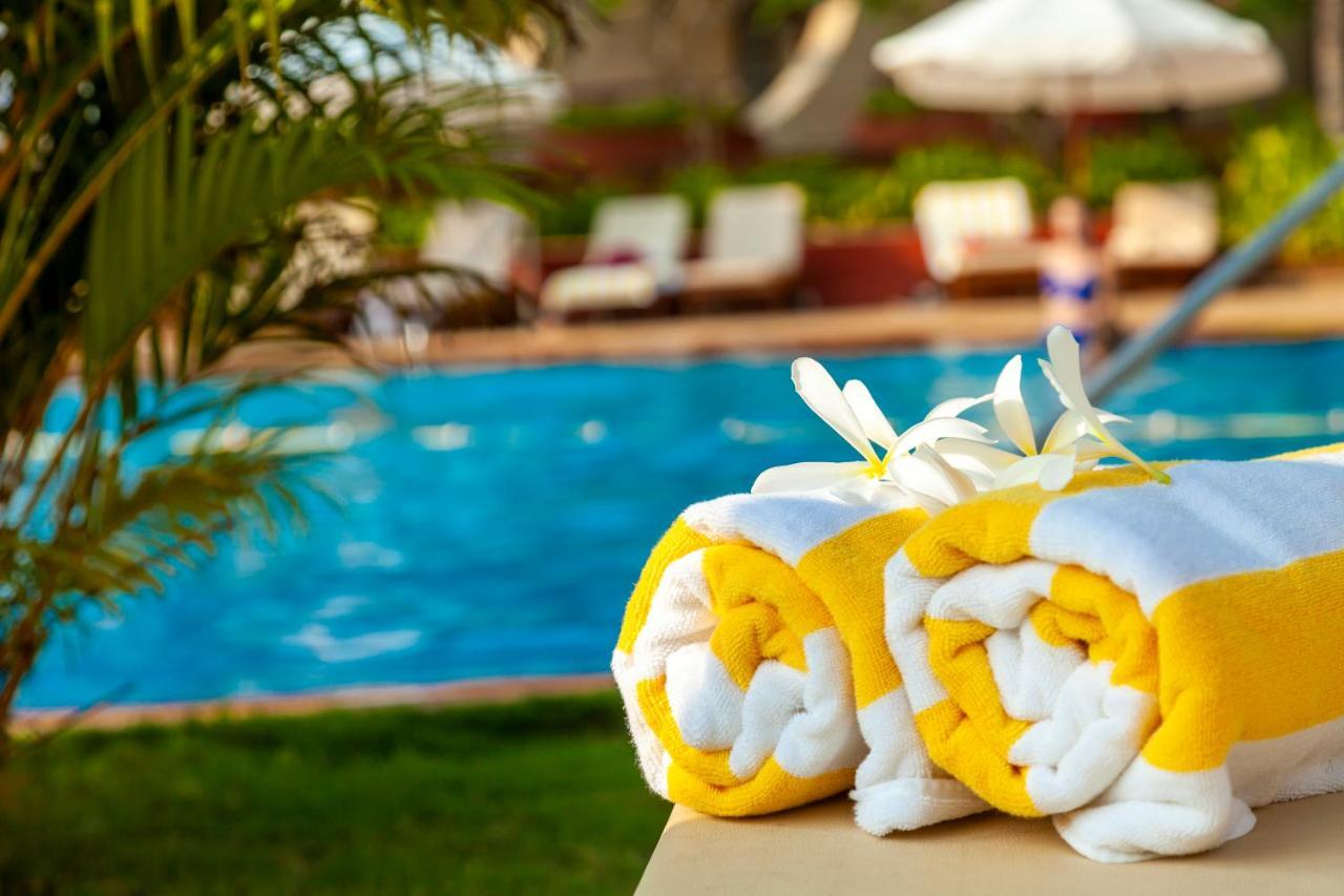 Caravela Beach Resort Varca Extérieur photo Pool towels