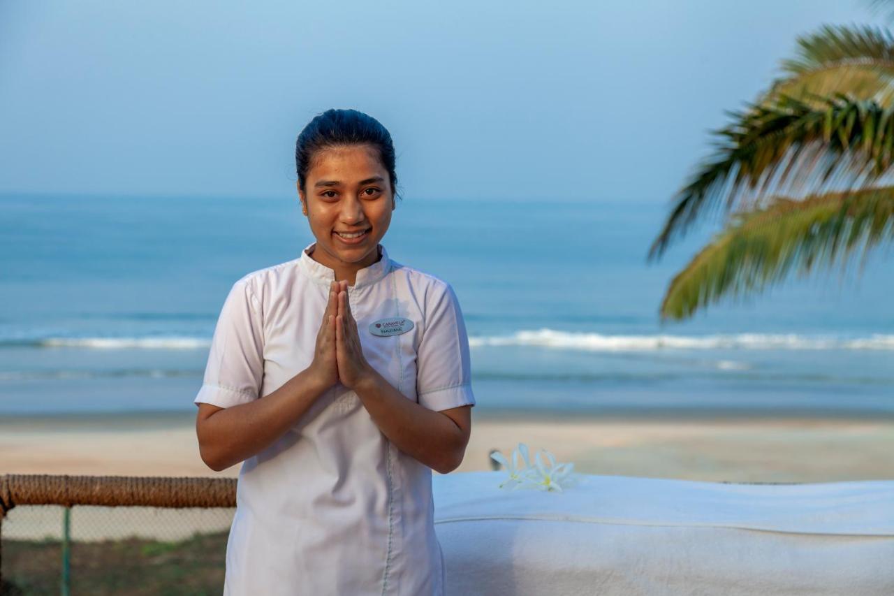 Caravela Beach Resort Varca Extérieur photo A hotel employee in India